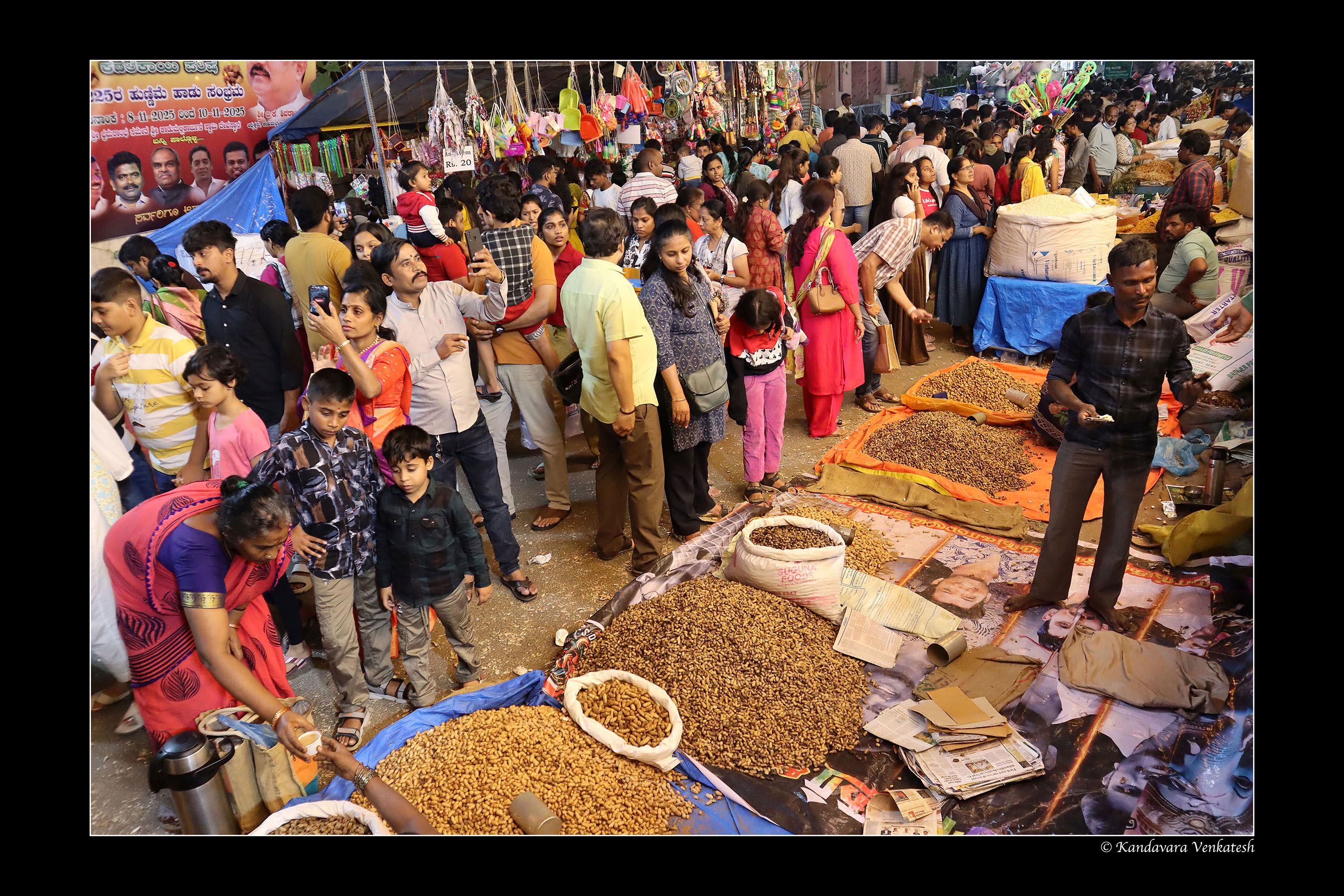 Visitors wandering through peanut fair stalls